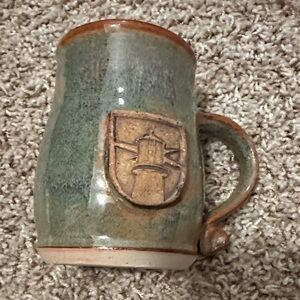 Handcrafted Ceramic Mug with Lighthouse Emblem Blue Green Pottery Coastal